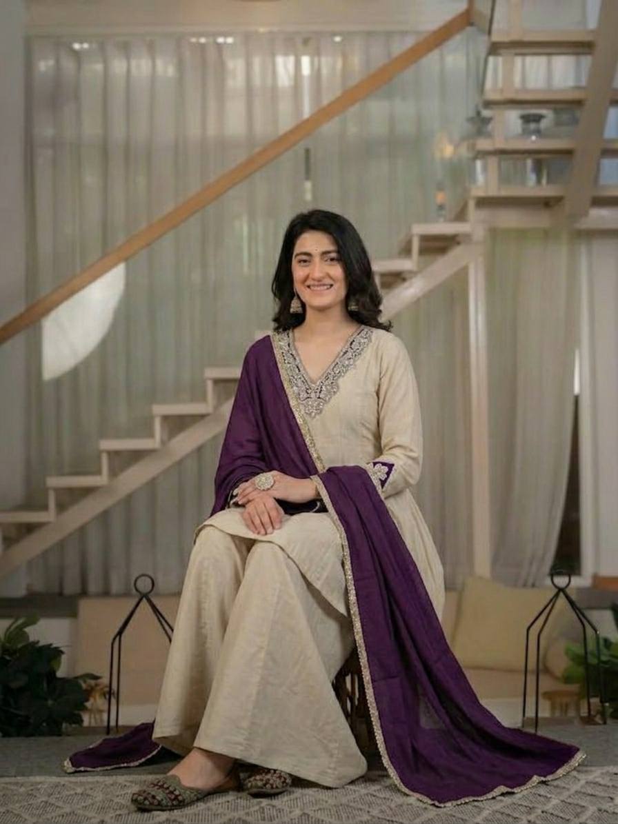 Regal Cream Silk Peplum Kurti and Flared Palazzo Suit Set Adorned with Ornate V-Neck Embroidery and a Rich Plum Purple Dupatta